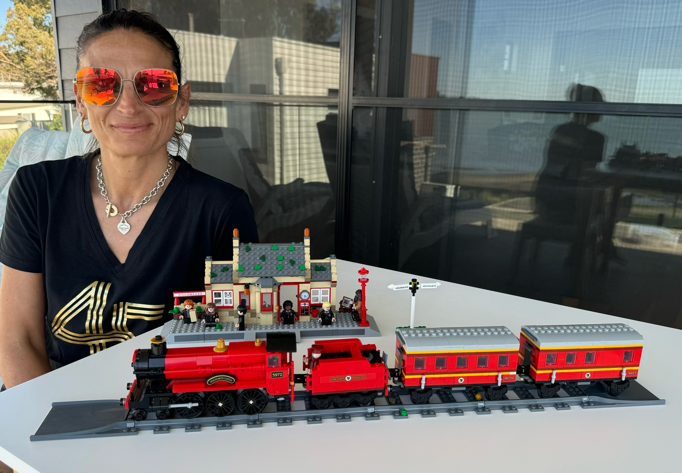 Picture of Rene with Hogwarts Express and Hogsmeade station train setPicture of Rene with Hogwarts Express and Hogsmeade station train set