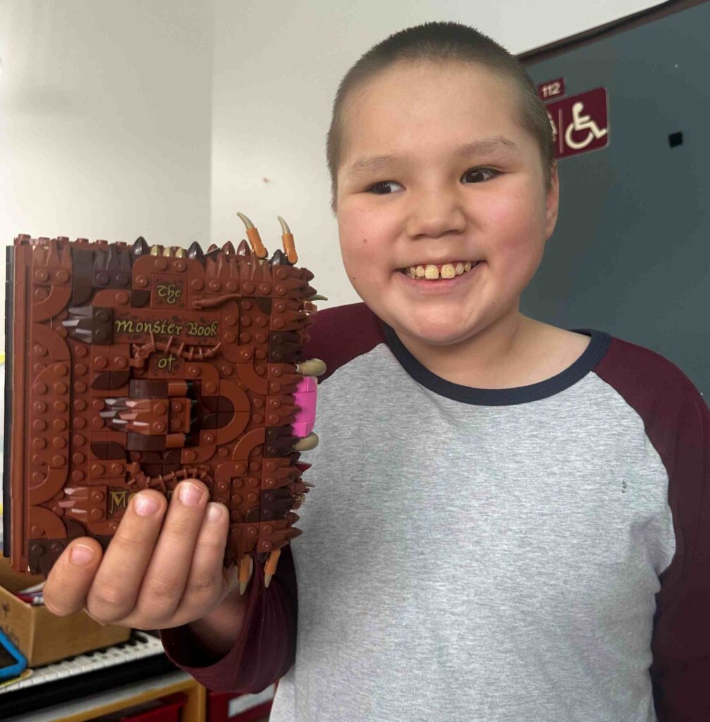 photo of Jonathan holding his build of the Chompint mo